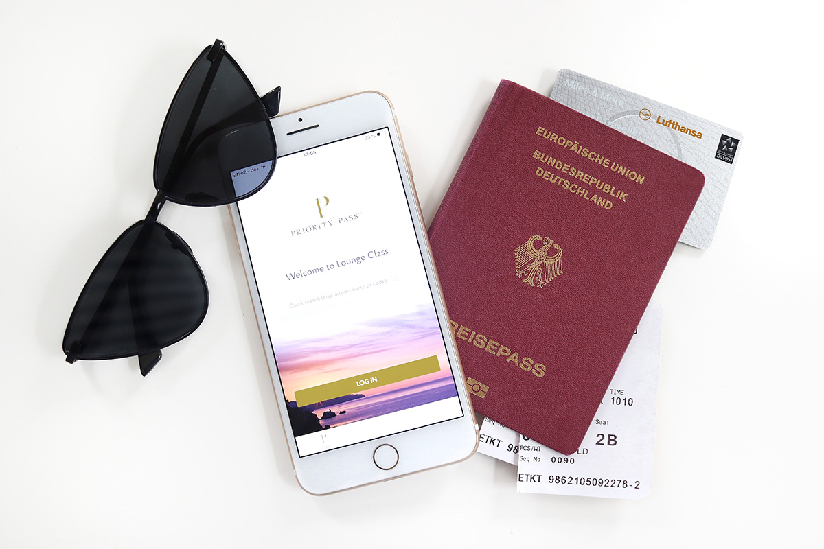 German passport, miles&more card, priority pass, sunglasses, blog post about long-haul flights on Lifetime-pieces.com