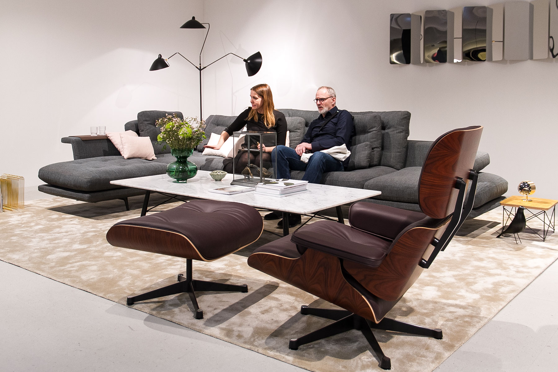 Grand Sofà grey by Antonio Citterio, Eames Lounge Chair brown, marble coffee table, stand exhibitor Vitra at imm cologne fair 2018, blog post lifetime-pieces.com