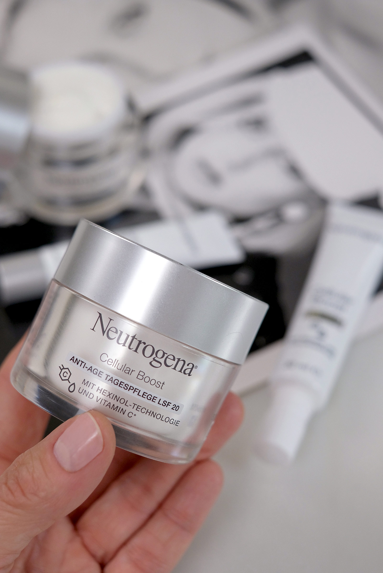 neutrogena, cellular boost, product, skincare, holded by a hand